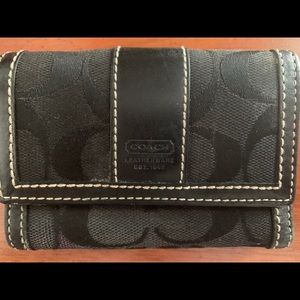1
Coach Black Signature Monogram Trifold Wallet